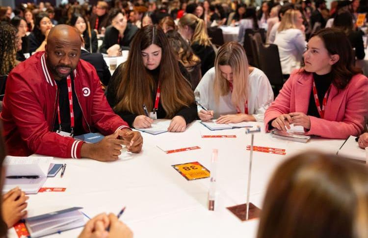 An expert from Target speaks to students at a round-table during the NRF Foundation Student Program